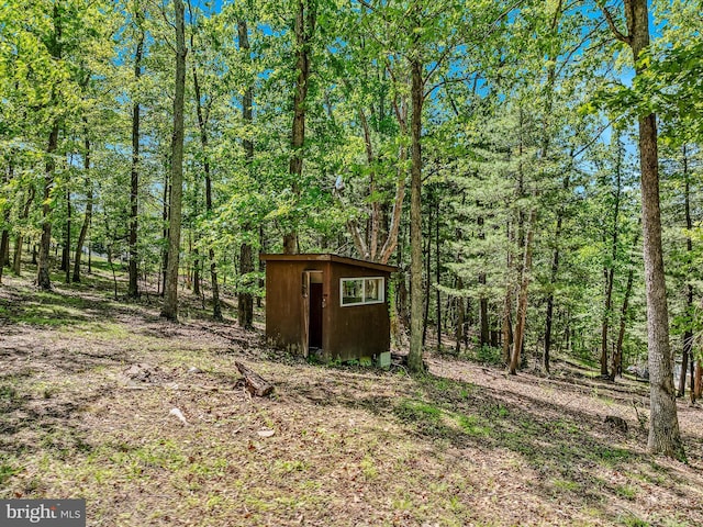3322 Johnsons Mill Rd, Berkeley Springs, WV 25411 - view of shed featuring a forest view