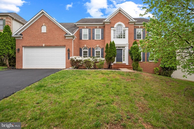 13017 English Turn Dr, Silver Spring, MD 20904 - view of front of house with brick siding, a garage, driveway, and a front yard