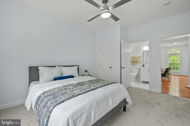 13017 English Turn Dr, Silver Spring, MD 20904 - carpeted bedroom featuring baseboards, a ceiling fan, and ensuite bath
