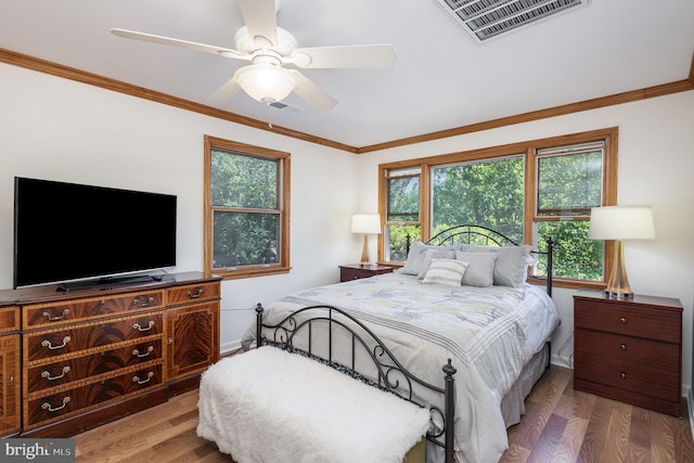 5511 Gwyn Pl, Alexandria, VA 22312 - bedroom with wood finished floors, baseboards, crown molding, and ceiling fan