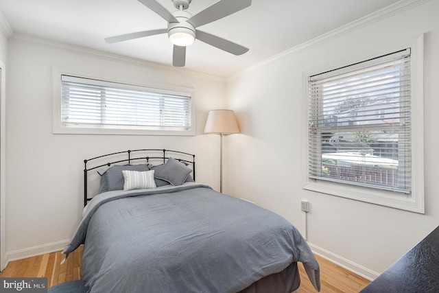 5511 Gwyn Pl, Alexandria, VA 22312 - bedroom with ornamental molding, baseboards, wood finished floors, and a ceiling fan