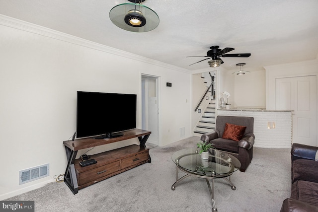 5511 Gwyn Pl, Alexandria, VA 22312 - living area with carpet flooring, stairway, ornamental molding, a ceiling fan, and baseboards
