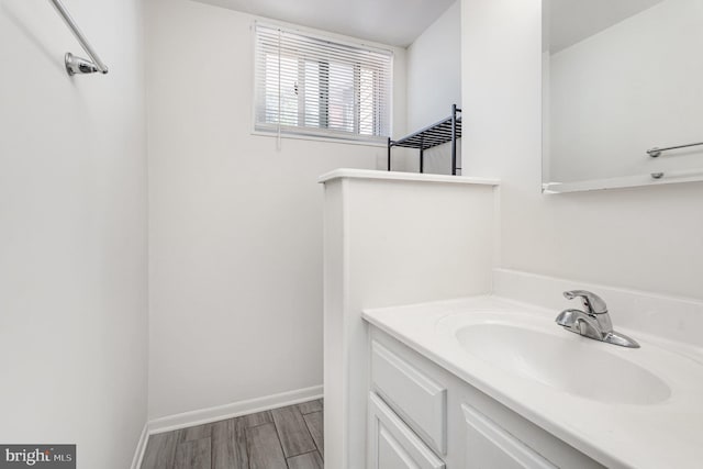5511 Gwyn Pl, Alexandria, VA 22312 - bathroom with wood finished floors, vanity, and baseboards