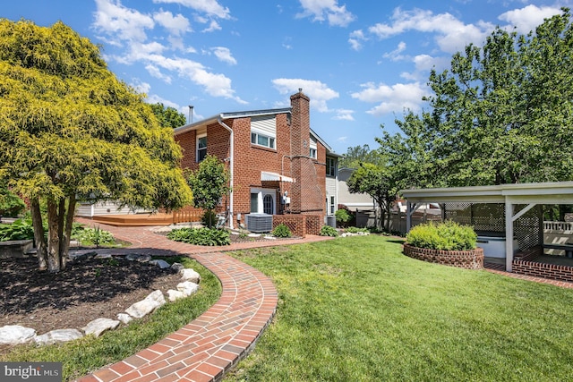 5511 Gwyn Pl, Alexandria, VA 22312 - rear view of house with a chimney, brick siding, and central air condition unit