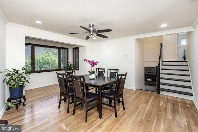 5511 Gwyn Pl, Alexandria, VA 22312 - dining area with ceiling fan, crown molding, stairway, healthy amount of natural light, and light wood-style floors