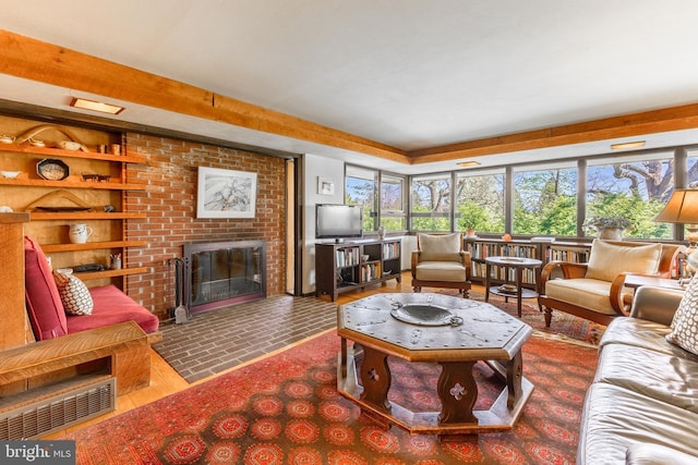 715 W Park Ave, State College, PA 16803 - living area with visible vents, a brick fireplace, a wealth of natural light, and built in shelves
