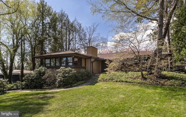 715 W Park Ave, State College, PA 16803 - exterior space with a lawn and a chimney