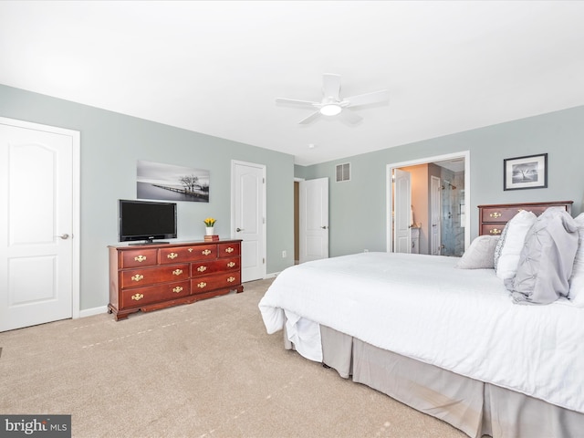carpeted bedroom featuring baseboards, a ceiling fan, and visible vents