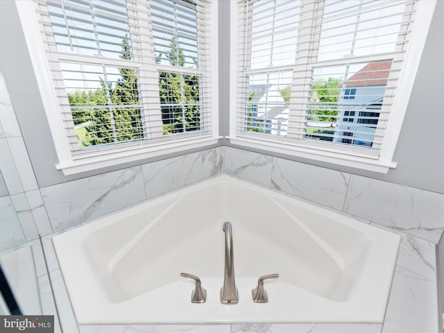 full bath with a garden tub