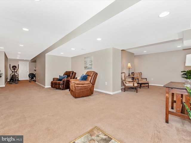 living area with recessed lighting, baseboards, and light carpet