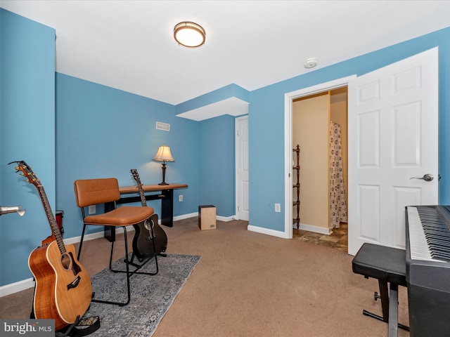 home office with carpet floors and baseboards