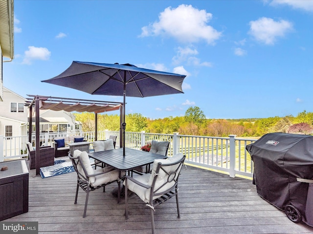 deck featuring grilling area, a pergola, outdoor lounge area, and outdoor dining space