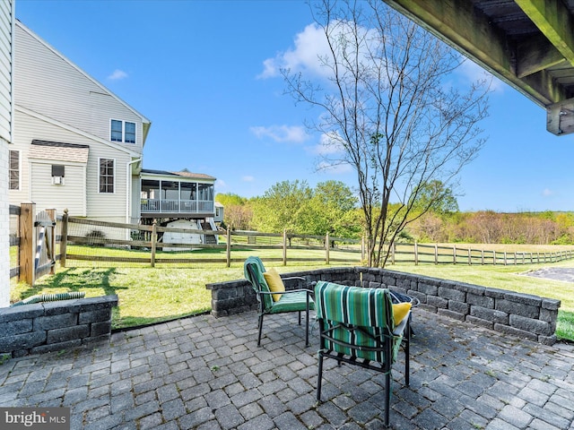 view of patio / terrace with a fenced backyard and a sunroom