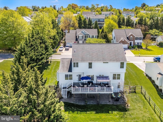birds eye view of property with a residential view