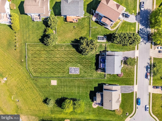 birds eye view of property with a residential view