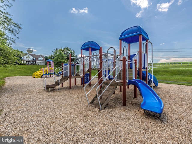community jungle gym with a yard