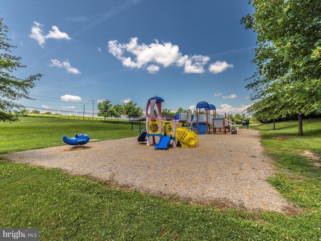 community playground featuring a lawn