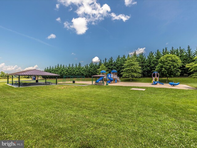 view of property's community featuring a gazebo, a yard, and playground community