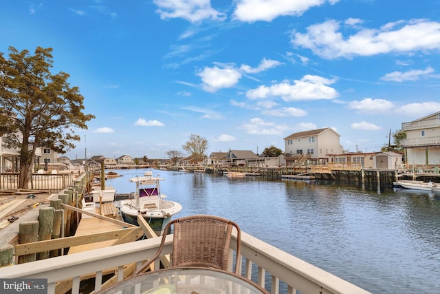 water view featuring a boat dock and a residential view