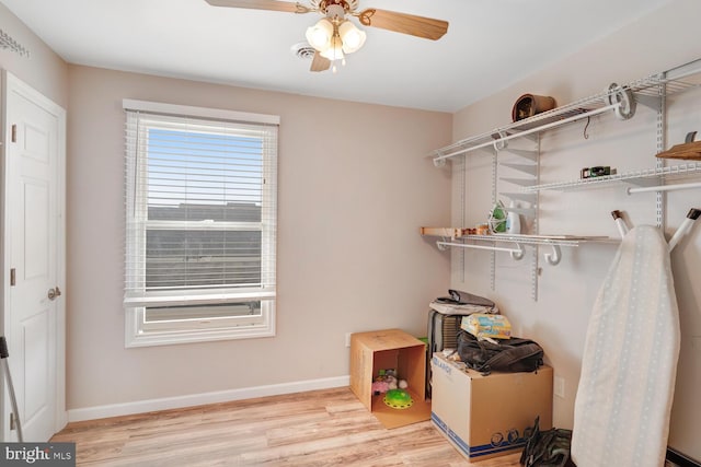 storage room with a ceiling fan