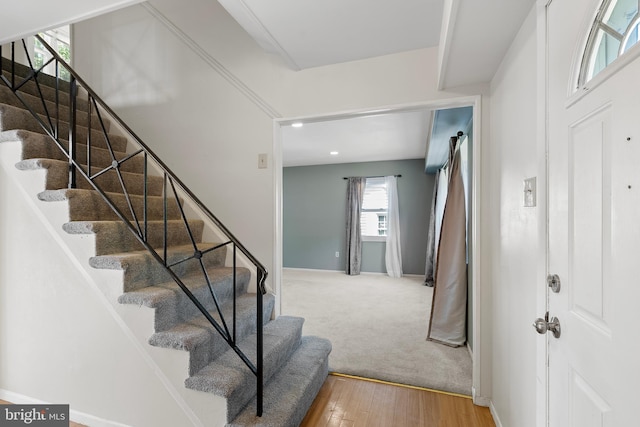 entryway featuring baseboards, stairs, recessed lighting, and wood-type flooring