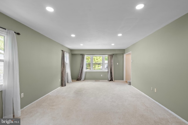 unfurnished room featuring carpet, baseboards, and recessed lighting