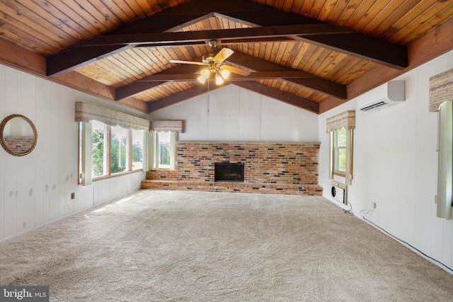 unfurnished living room with carpet, a wealth of natural light, a wall unit AC, and a brick fireplace