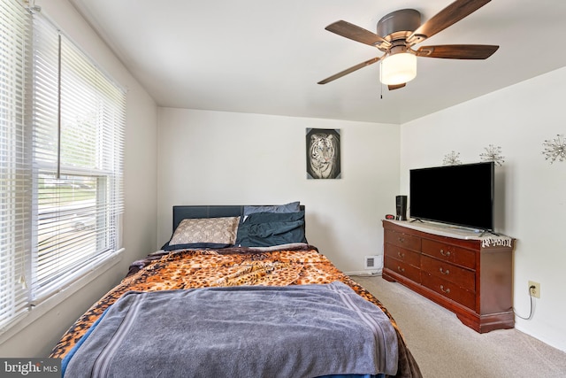 bedroom with carpet, baseboards, and ceiling fan