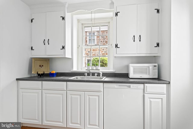 bar featuring a sink and white appliances