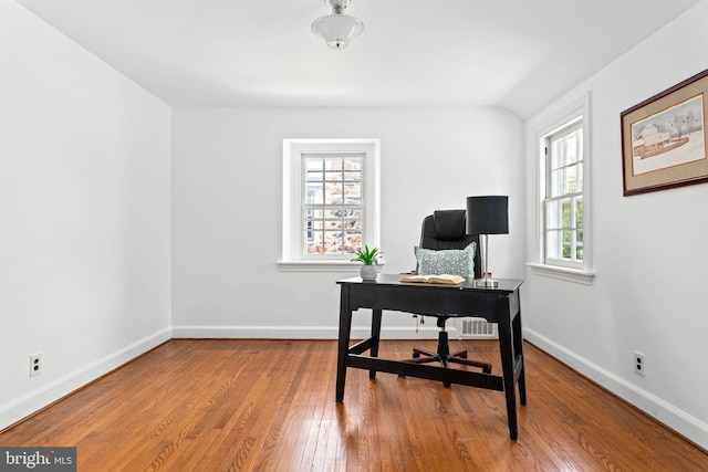 office space with baseboards and hardwood / wood-style flooring