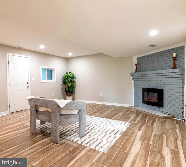 unfurnished living room featuring light wood finished floors, baseboards, visible vents, recessed lighting, and a fireplace