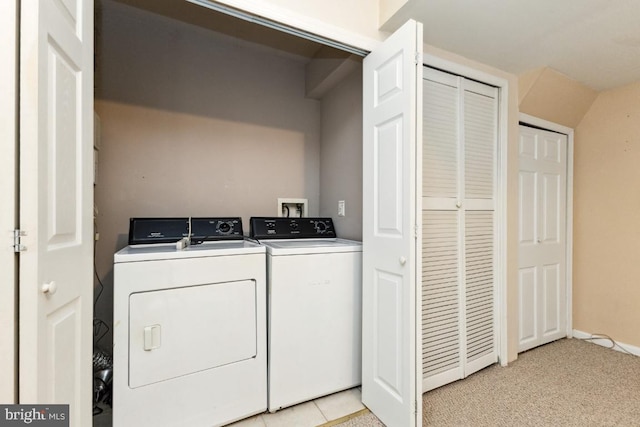 clothes washing area featuring independent washer and dryer and laundry area