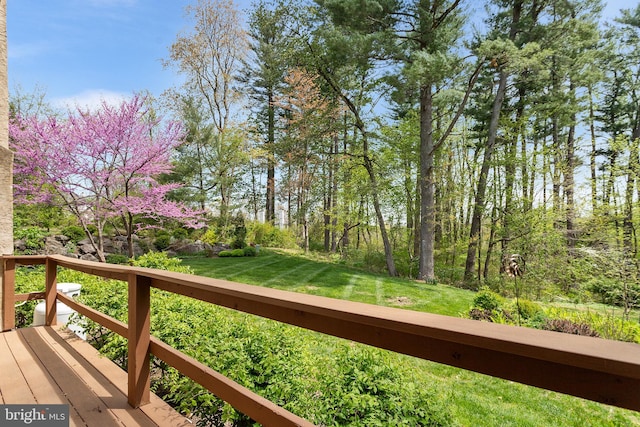 wooden deck with a yard