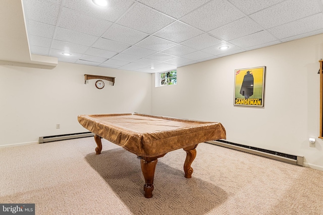 game room with a baseboard heating unit, carpet flooring, and a paneled ceiling