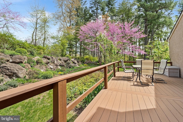deck featuring outdoor dining area