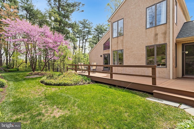 view of yard featuring a wooden deck