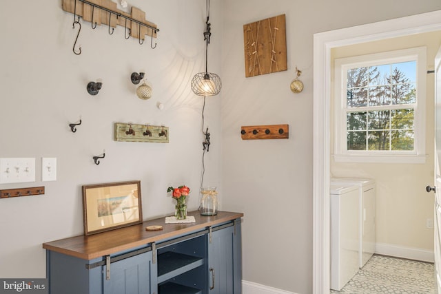 interior space featuring baseboards and washing machine and dryer