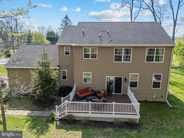 back of property featuring an outdoor living space, a wooden deck, and a yard