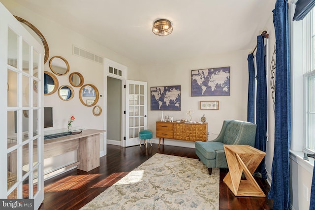 sitting room with baseboards, french doors, dark wood-style floors, and visible vents