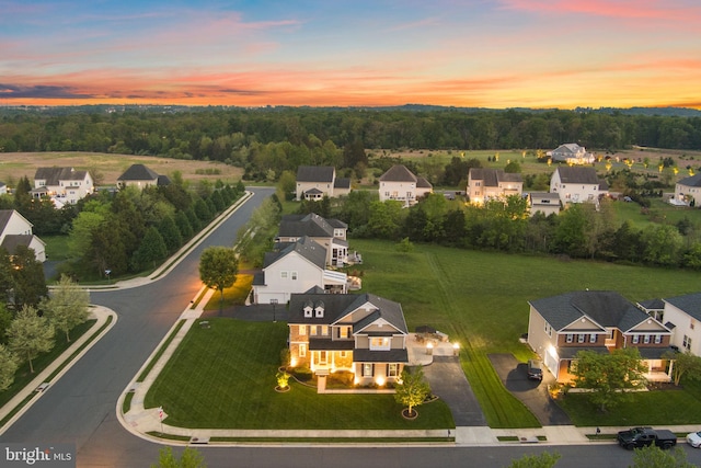 aerial view at dusk with a residential view