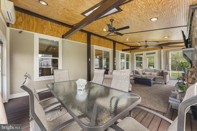 exterior space featuring a deck, outdoor lounge area, an AC wall unit, outdoor dining area, and a ceiling fan