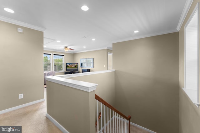 hall with crown molding, baseboards, recessed lighting, light colored carpet, and an upstairs landing