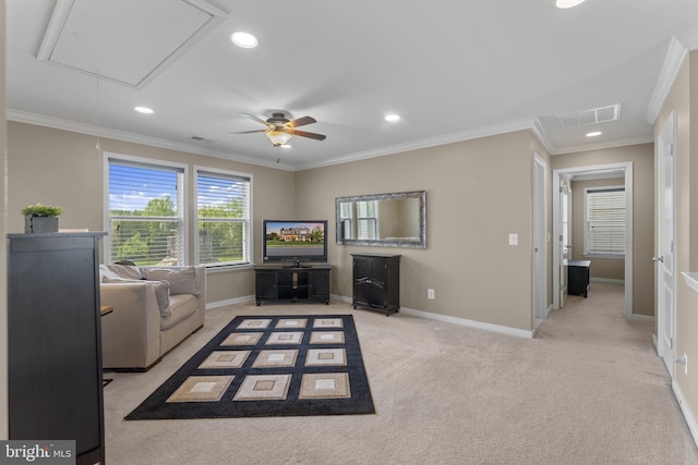 living area with crown molding, recessed lighting, visible vents, and attic access