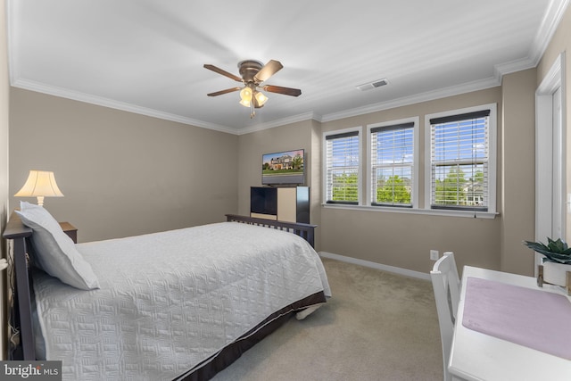 carpeted bedroom featuring crown molding, baseboards, visible vents, and ceiling fan