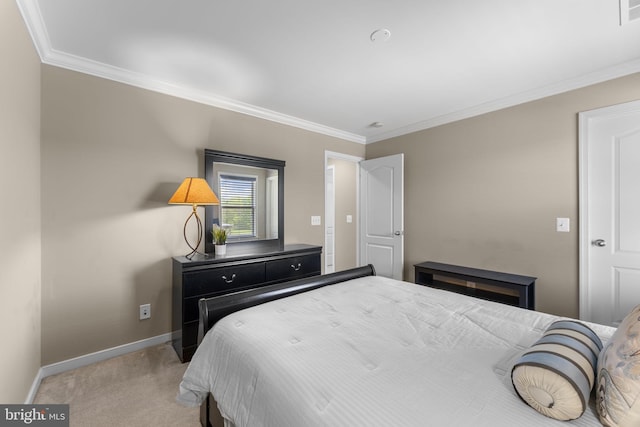 bedroom featuring baseboards, light colored carpet, ornamental molding, and visible vents