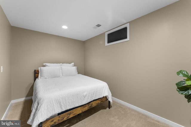 carpeted bedroom featuring baseboards, recessed lighting, and visible vents