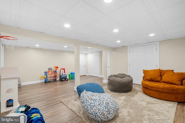 playroom featuring baseboards, recessed lighting, and wood finished floors