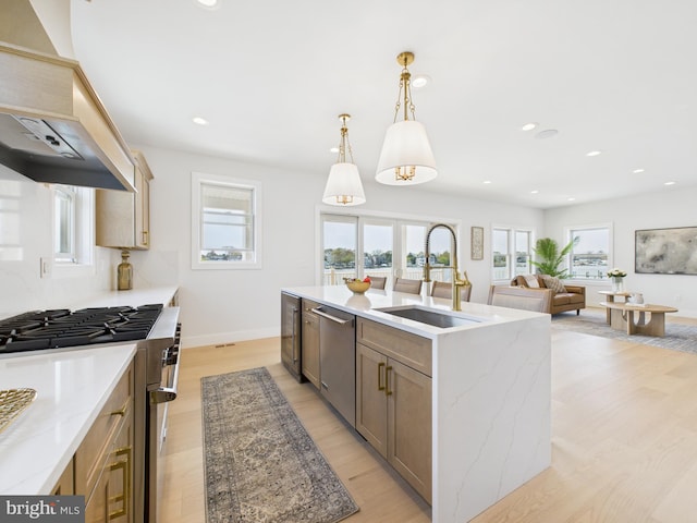 29 Bay Way, Brick, NJ 08723 - kitchen featuring a sink, a center island with sink, hanging light fixtures, appliances with stainless steel finishes, and beverage cooler