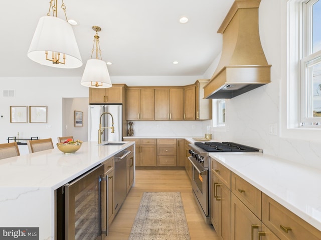 29 Bay Way, Brick, NJ 08723 - kitchen with custom range hood, a sink, beverage cooler, light wood-style floors, and high quality appliances