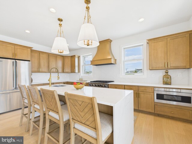 29 Bay Way, Brick, NJ 08723 - kitchen featuring a sink, custom range hood, light wood-style flooring, and stainless steel appliances
